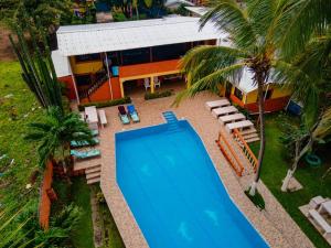 an overhead view of a swimming pool in front of a house at Casa Rector - Beach House Rental in El Roble