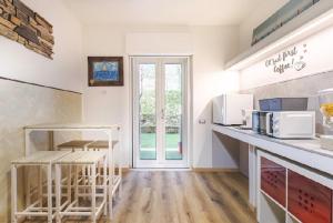 a kitchen with white counters and a counter top at Trieste Sea Life in Trieste