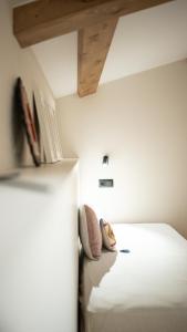 a bedroom with a bed and a wooden ceiling at iSlow Costa da Morte in Laxe