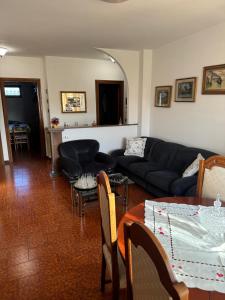 a living room with a couch and a table at Casa di Anna in Graffignano +1 photo
