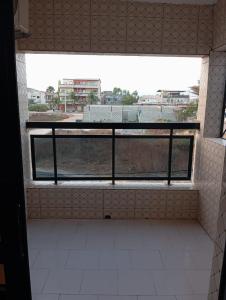 an empty room with a window in a building at Keur Vieux DIATTA in Ziguinchor