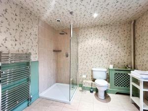 a bathroom with a toilet and a glass shower at Cottage 1 - Uk46611 in Broughton