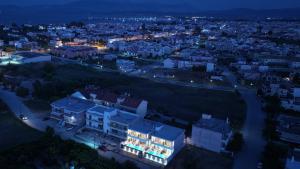 a view of a city at night at Elysian Luxury Suite in Preveza