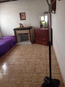 a room with a bedroom with a bed and a table at Valdez Resi in Santa Rosa