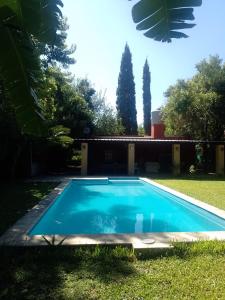 a swimming pool in the yard of a house at CASA QUINTA Sasha in Sauce Viejo +3 photos