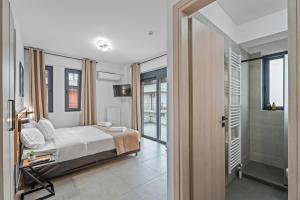 a bedroom with a bed and a walk in shower at Athens Vein in Athens +29 photos