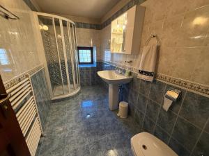 a bathroom with a sink and a toilet at White Wolf Chalet in Bansko +26 photos