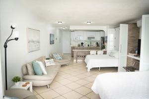 a living room with a couch and a bed at Sea For Yourself in Fajardo