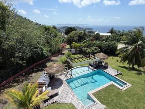 an image of a swimming pool in a yard at forst home with a great ocean view in Kingstown