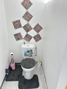a small bathroom with a toilet in a room at Dolce Vita Emilia in Sainte-Luce +7 photos
