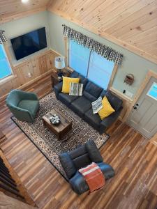 an overhead view of a living room with a couch at Cattail Cabin in Waterville