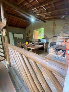 a kitchen with a wooden fence and a table at Suítes no centro Histórico Diamantina in Diamantina