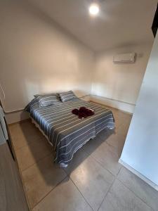 a bedroom with a bed with a stuffed animal on it at Sierras y Volcanes in Taninga