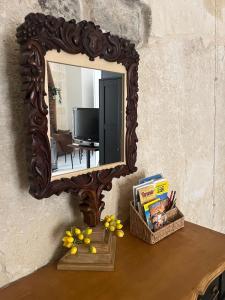 a mirror sitting on top of a table at ITALY Home 16 in Grottaglie