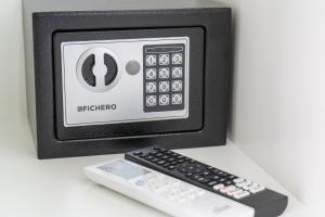 a remote control sitting next to a tv at Mulino Suites in Scalea +23 photos