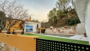 a villa with a swimming pool and a fence at Casa Angel 3 in Castril
