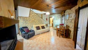 a living room with a couch and a table at Casa Angel 3 in Castril