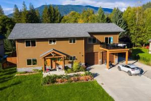 an aerial view of a house with a car parked in the driveway at Big Bear Chalet and spa in Revelstoke