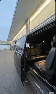 a back end of a van parked next to an airport at Guided city Tour package in Tangier