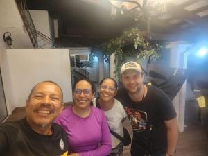 a group of four people posing for a picture at Hostel Chaton in Asunción +22 photos