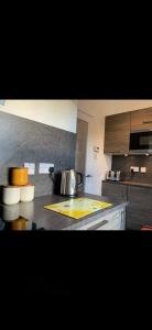 a kitchen with a counter top with a pan on it at Misty Isles View in Portree