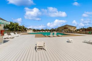 a deck with lounge chairs and a swimming pool at AV723 Prickly Pear 723 in Avon