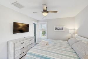 a bedroom with a bed and a flat screen tv at AV723 Prickly Pear 723 in Avon +37 photos