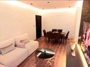 a living room with a white couch and a table at Suite Bahiya unica in Fez +16 photos