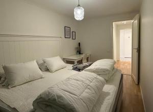 a bedroom with two beds with pillows on it at Siam Homestay in Mölndal