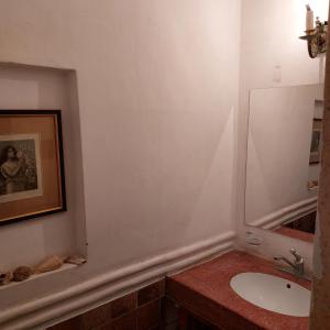 a bathroom with a sink and a mirror at Casona El Olivo in Villa Krause +15 photos