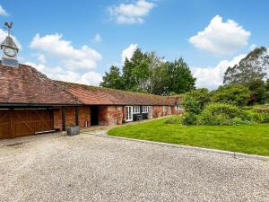 an old brick building with a clock tower at Cottage 2 - Uk46612 in Broughton +10 photos