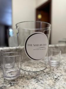 three glasses sitting on top of a counter at The Shelby Inn in Shelbyville