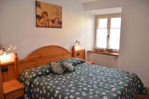 A bed or beds in a room at Residence Ca' Delle Margherite