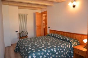 A bed or beds in a room at Residence Ca' Delle Margherite