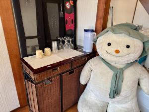a large teddy bear standing in front of a bathroom counter at ANFT-shiro in Azumino +52 photos