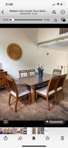 a picture of a table and chairs in a room at MGerais Pousada in Visconde do Rio Branco