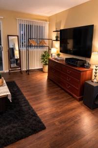 a living room with a large flat screen tv at Carson in Carson