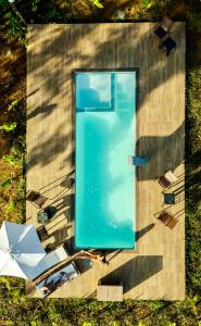 an overhead view of a blue table and an umbrella at Chalés Pura Vida in Itacaré