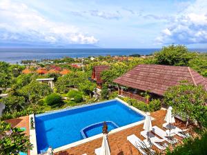 an aerial view of a swimming pool next to a house at Darya Sea View by ABM in Nusa Penida