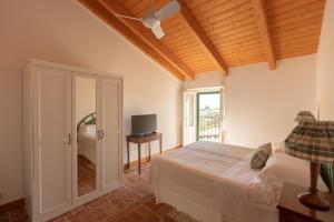 a bedroom with a bed and a television in a room at Agriturismo Villa Fiore in Torano Nuovo +164 photos