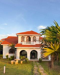 a large house with an orange roof at Uttoru Creek Villa-2 in Mombasa