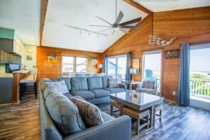 a living room with a couch and a table at AVWI1 Beach Stars #1-WI in Avon