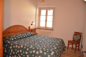 A bed or beds in a room at Residence Ca' Delle Margherite