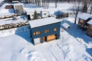 an aerial view of a house in the snow at torinuma VILLA in Furano