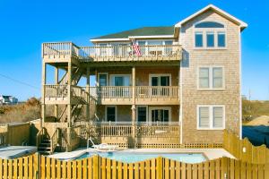 a house with a deck and a swimming pool at BXOLRD2 Native Sun #9-BB in Buxton