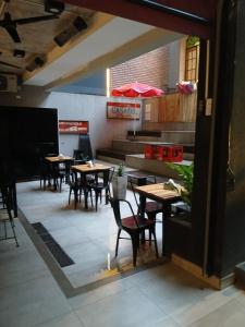 an empty dining room with tables and chairs at zona balcarce in Salta