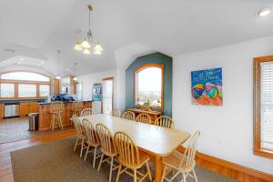a dining room and kitchen with a table and chairs at BXOLRD2 Native Sun #9-BB in Buxton