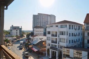 a view of a city street with tall buildings at Aroma Hostel in Vientiane