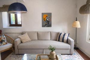a living room with a couch and a table at La casina de Barro in Llanes