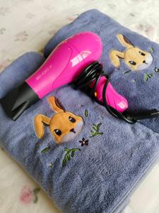 a pink phone sitting on top of a towel at Bake for You Camping in Ban Nong Bua +26 photos